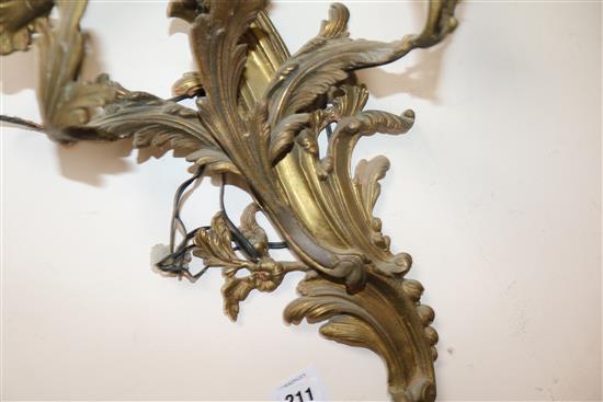 A pair of three branch ormolu wall lights length 55cm